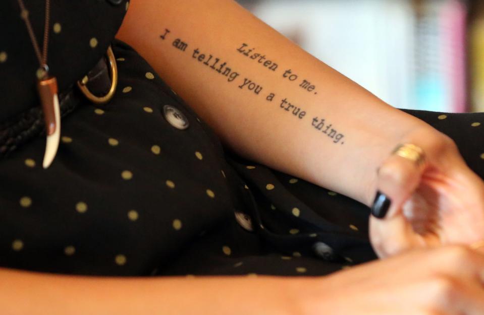 Portsmouth poet laureate Diannely Antigua has a tattoo that helps explain her evolution as a person and writer.