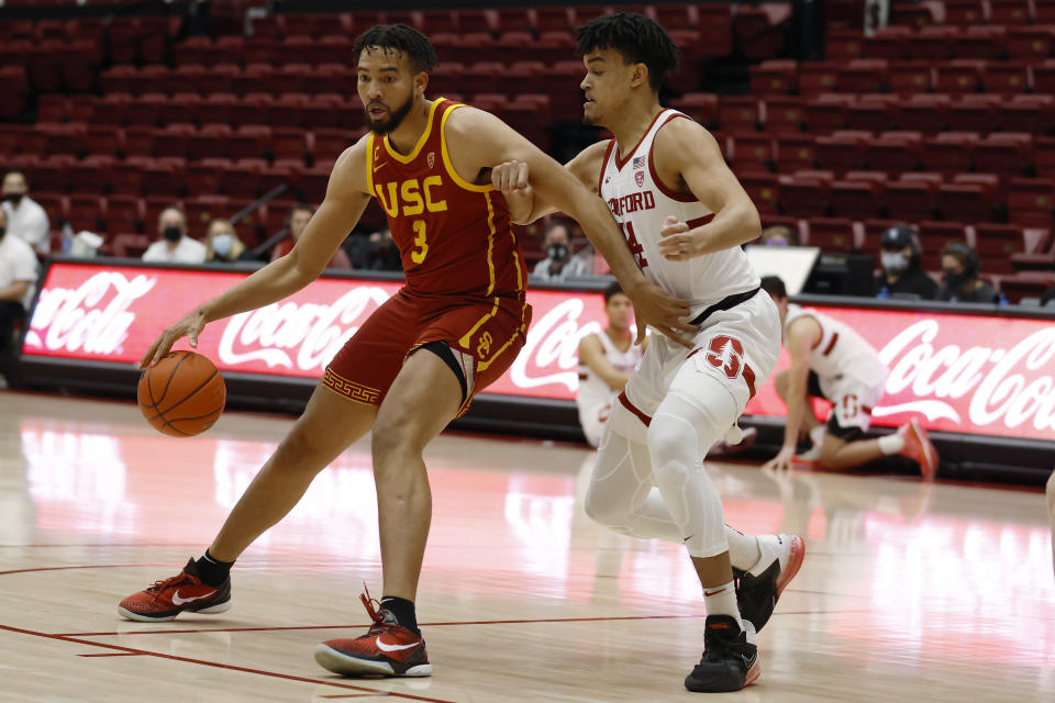 Southern California forward Isaiah Mobley (3) drives for the basket as Stanford forward Spencer Jones (14) defends during the first half of an NCAA college basketball game Tuesday, Jan. 11, 2022, in Stanford, Calif. (AP Photo/Josie Lepe)