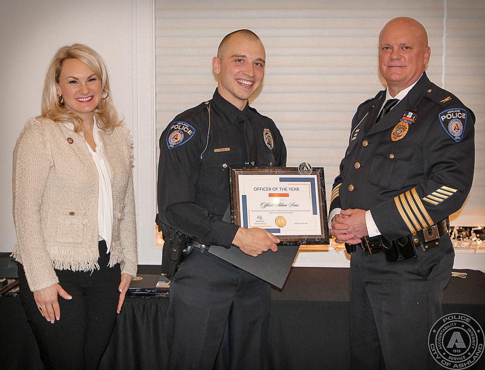 2022 Officer of the Year L to R; State Rep. Melanie Miller, Officer Adam Srnis, Chief David Lay