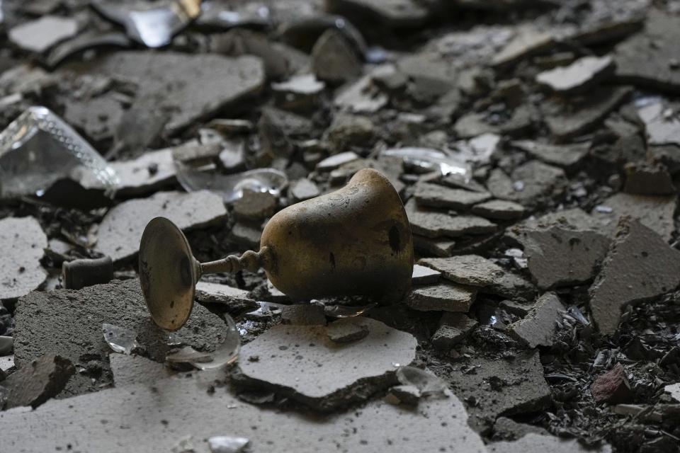 A burnt Kiddush Cup in a house damaged by Hamas militants is seen in Kibbutz Be'eri, Israel, Saturday, Oct. 14, 2023. The kibbutz was overrun by Hamas militants from the nearby Gaza Strip on Oct. 7, when they killed and captured many Israelis. Two weeks after Hamas militants gunned down 10 percent of their community, torturing scores of people and kidnapping many back to Gaza, the Israeli government has relocated half the kibbutz to the upscale David Resort, a hotel-turned-refugee camp.(AP Photo/Ariel Schalit, File)