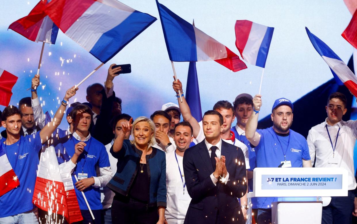 Marine Le Pen, President of the French far-right National Rally (Rassemblement National - RN) party parliamentary group, and Jordan Bardella, President of the French far-right National Rally (Rassemblement National - RN) party and head of the RN list for the European elections, attend a political rally during the party's campaign for the EU elections, in Paris, France, June 2, 2024