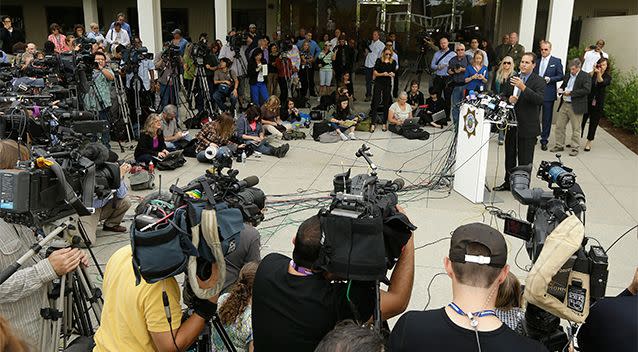 Lt. Keith Boyd, assistant chief deputy coroner for the Marin County Sheriff's Office, at podium, speaks at a packed news conference about the death of Robin Williams in San Rafael, California. Photo: AP.