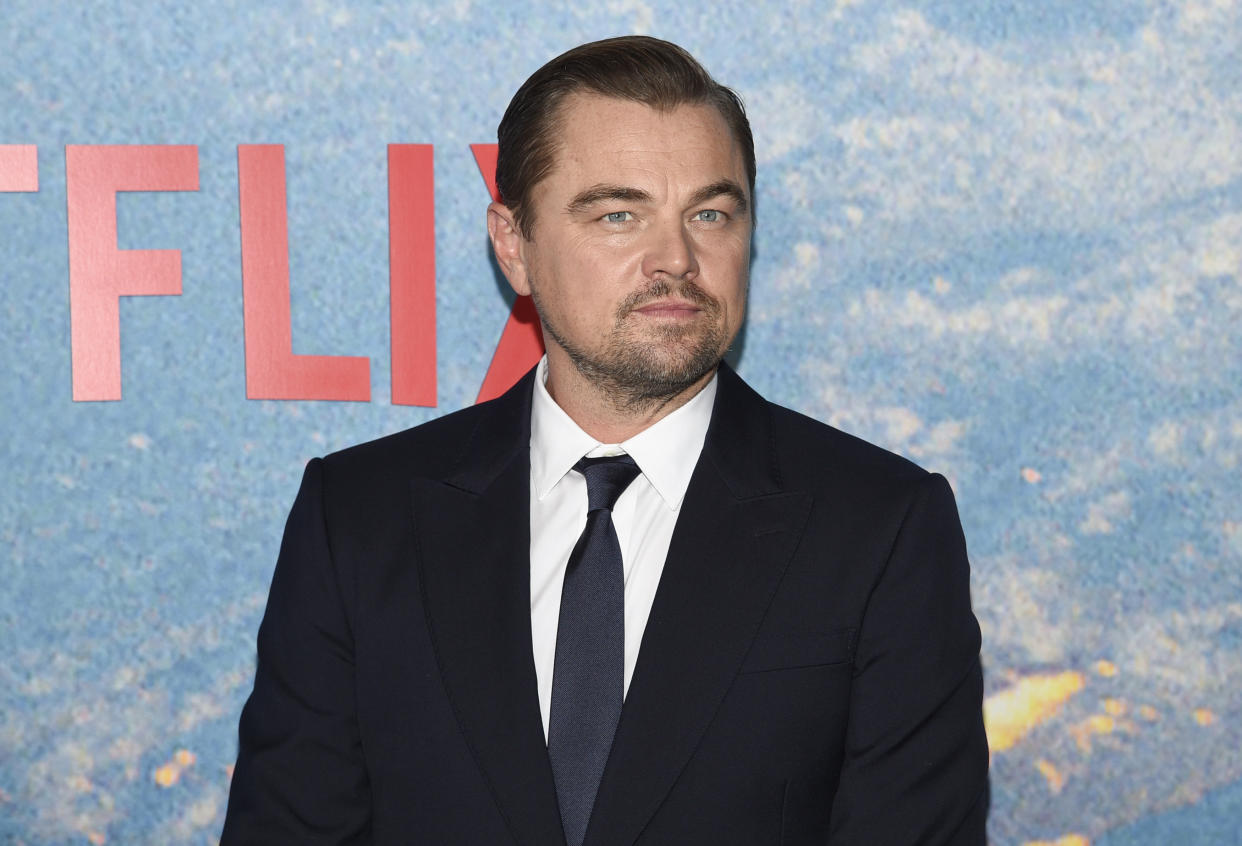 Leonardo DiCaprio, wearing a suit and tie, at the world premiere of the movie Don’t Look Up.