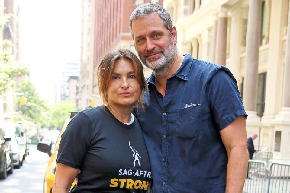 <p>Christopher Peterson / SplashNews.com</p> Mariska Hargitay and Peter Hermann walk the SAG-AFTRA and WGA picket line outside Warners Brothers HQ in New York City