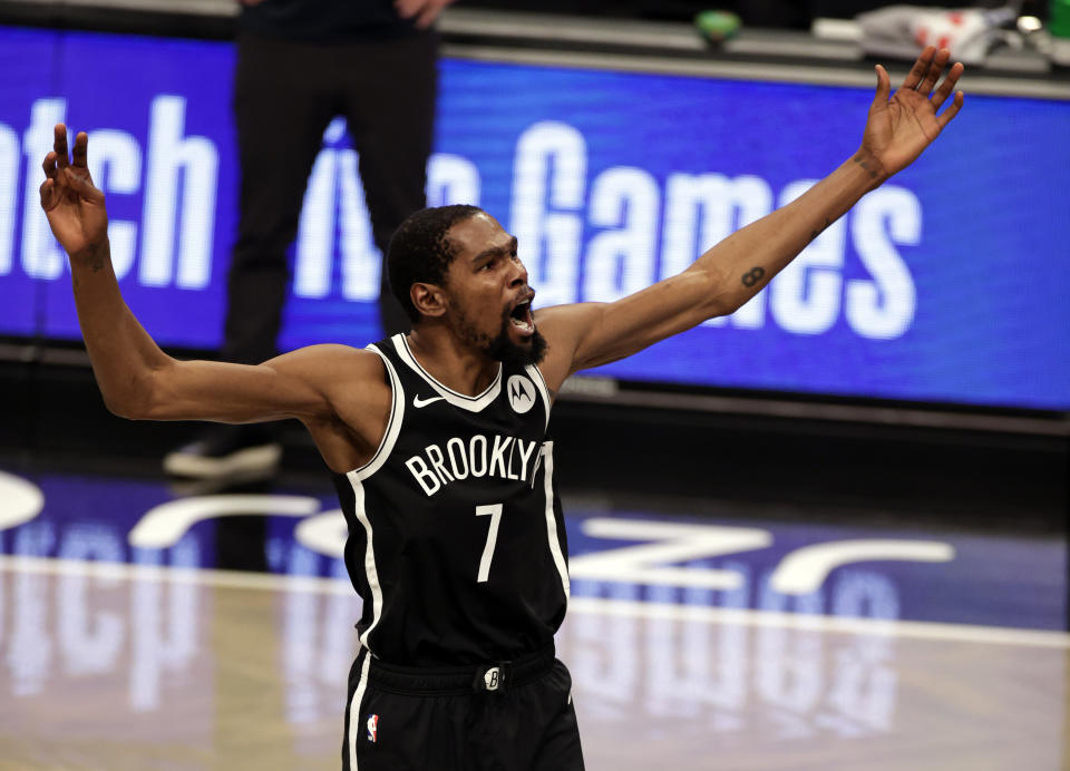 Brooklyn Nets forward Kevin Durant reacts against the Milwaukee Bucks during the first half of an NBA basketball game Monday, Jan. 18, 2021, in New York. (AP Photo/Adam Hunger)