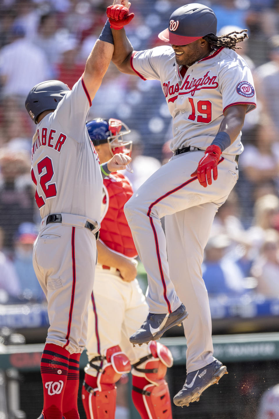 Washington Nationals' Josh Bell (19) celebrates with Kyle Schwarber (12) after hitting a grand slam home run during the sixth inning of a baseball game against the Philadelphia Phillies, Wednesday, June 23, 2021, in Philadelphia. (AP Photo/Laurence Kesterson)