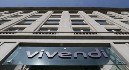 FILE PHOTO - A logo is seen over the main entrance of the entertainment-to-telecoms conglomerate Vivendi's headquarters in Paris April 8, 2015.       REUTERS/Gonzalo Fuentes