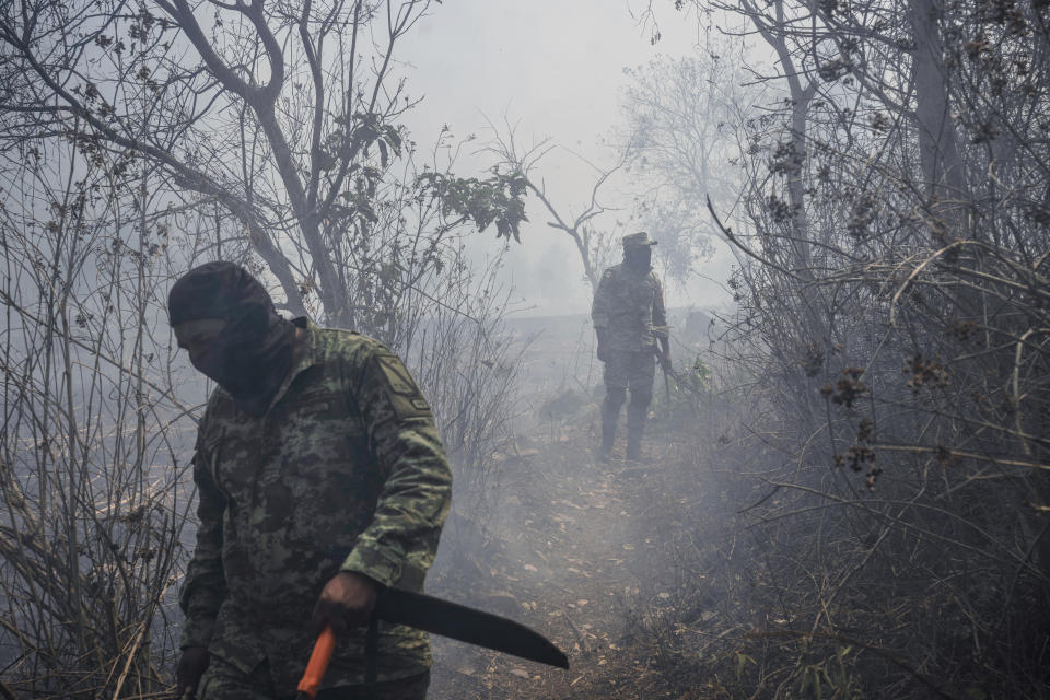 Soldiers work to contain wildfires in Nogales, in the High Mountains area of Veracruz state, Mexico, Monday, March 25, 2024.(AP Photo/Felix Marquez)