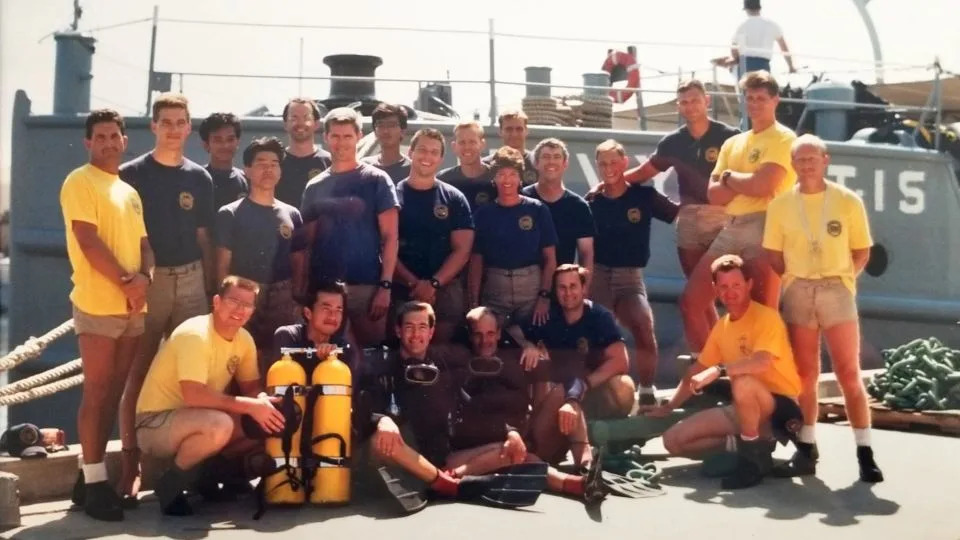Jonathan Clark met his future wife, Mission Specialist Laurel B. Clark, at US Navy diving school in 1989. Laurel (near center) was the only woman who completed the course. Jonathan is seen standing behind her right shoulder. - Courtesy of Jonathan Clark