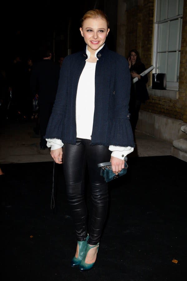 Chloë wore a little black jacket to Chanel's "Little Black Jacket" exhibit, where she accessorized with pops of green.