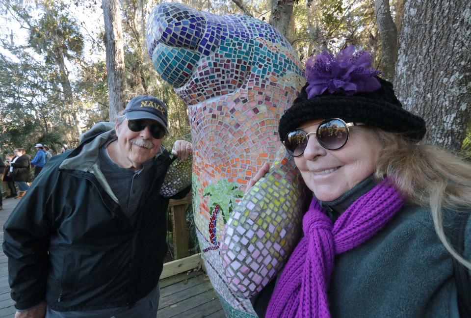 Robert and Norma Jean Wilson, from Ormond Beach, join the crowd checking out the manatees Thursday at Blue Spring State Park.