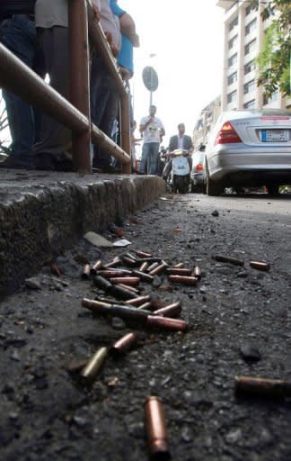 Bullet cases lie on the street outside the offices of pro-Syrian Arab Current Party in Beirut on Monday. The latest fighting erupted hours after reports emerged that Lebanese army troops had shot dead Sheikh Ahmad Abdul Wahad, a prominent anti-Syria Sunni cleric