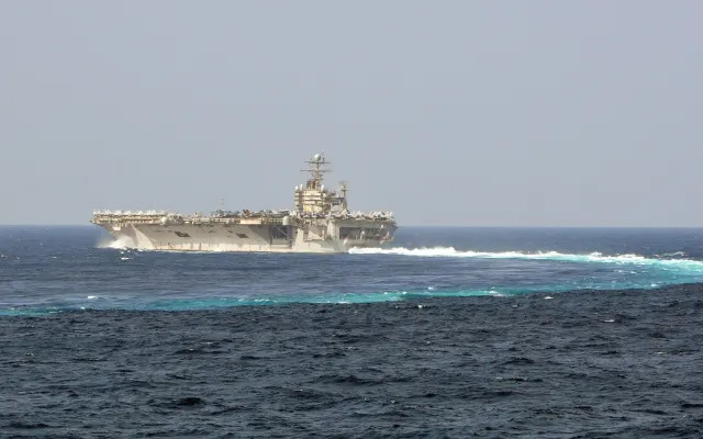 A large ship turning in the sea.