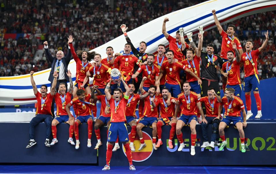 Alvaro Morata hoists the European Championship trophy aloft (Getty Images)