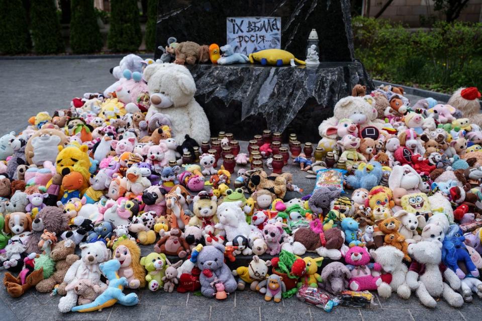 People brought toys to the monument of the children killed by Russian aggression in Kharkiv, Ukraine, on April 21, 2024. (Serhii Korovayny/The Kyiv Independent)