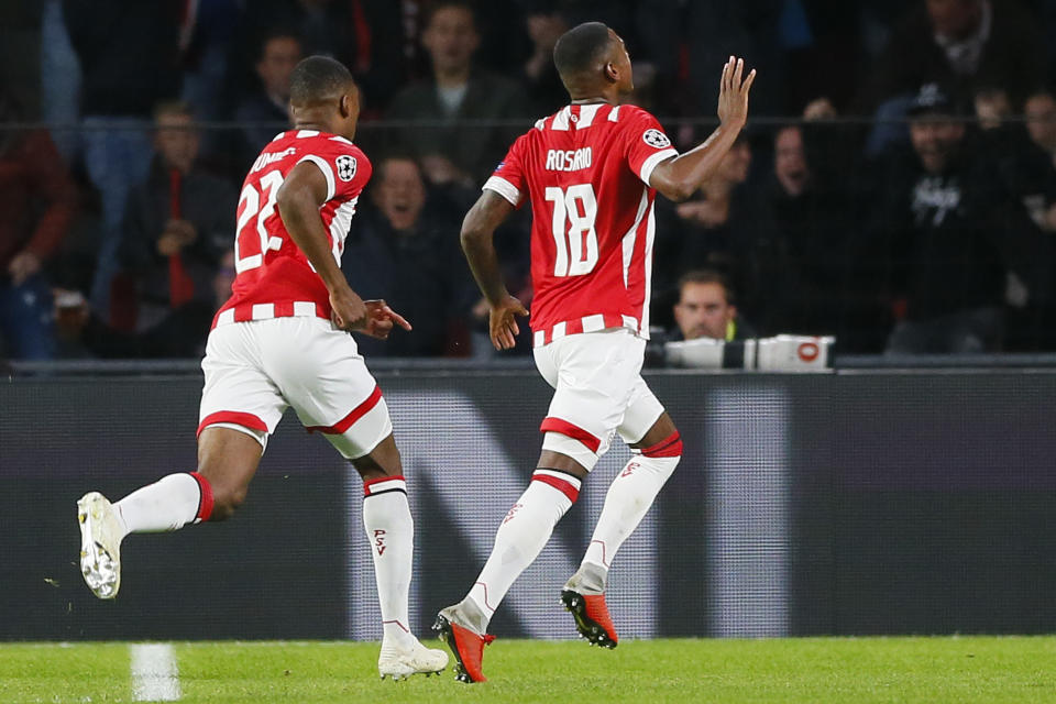 PSV's Denzel Dumfries, left, celebrates with teammate Pablo Rosario, right, who scored his side's first goal during a Group B Champions League soccer match between PSV and Inter Milan at the Philips stadium in Eindhoven, Netherlands, Wednesday, Oct. 3, 2018. (AP Photo/Peter Dejong)