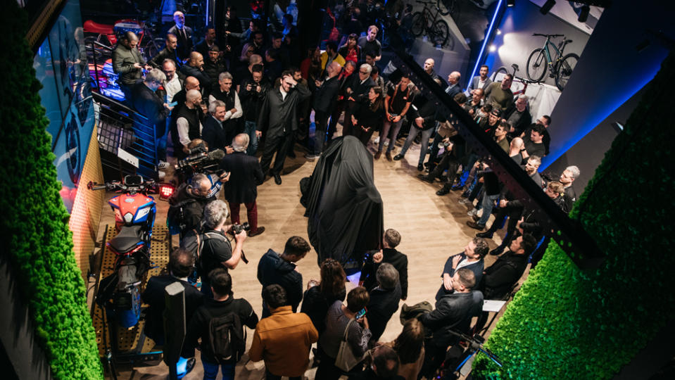 Attendees of the motorcycle industry's 2022 EICMA exhibition await a model debut.