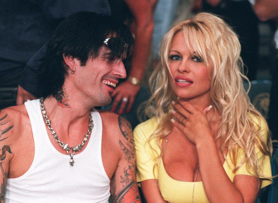 FILE -- Less than two weeks after filing for divorce, Pamela Anderson Lee and Motley Crue drummer Tommy Lee, shown in this 1995 file photo, are back together. ``I can definitely say they have reconciled,'' said Ann Israel, publicist for the curvy star of television's ``Baywatch'' on Monday, Dec. 2, 1996.  (AP Photo/File, Lennox McLendon)