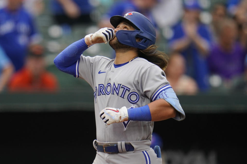 Toronto Blue Jays' Bo Bichette reacts after hitting a three-run home run off Baltimore Orioles relief pitcher Nick Vespi during the third inning of the second game of a baseball doubleheader, Monday, Sept. 5, 2022, in Baltimore. Blue Jays' Jackie Bradley Jr. and George Springer scored on the home run. (AP Photo/Julio Cortez)