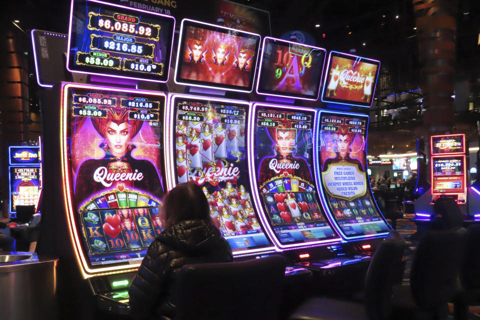 Gamblers play slot machines at the Ocean Casino Resort in Atlantic City N.J. on Dec. 2, 2022. On March 15, 2024, New Jersey gambling regulators released figures showing Atlantic City's nine casinos, the three horse tracks that accept sports bets, and their online partners won over $461 million in February, an increase of 12% from February 2023. (AP Photo/Wayne Parry)