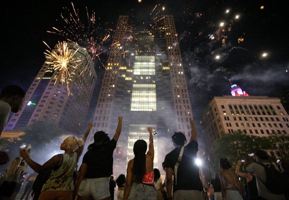 Fireworks were set off on High St. during a celebration of Juneteenth in front of the Statehouse, Friday, June 19, 2020. Demonstrators, blocked off High St. at Broad and State streets.  "Juneteenth 2020, were making history!" DJ Polomoe shouted over the mic. (Courtney Hergesheimer/Dispatch) 