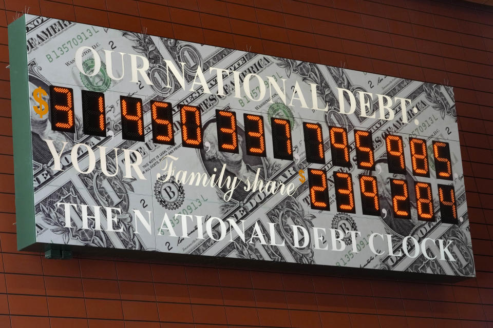 The national debt clock is seen in midtown Manhattan, Thursday, May 25, 2023. Both President Joe Biden and House Speaker Kevin McCarthy are speaking hopefully of the likelihood of an agreement to raise the government's debt limit and avert an economically chaotic federal default. (AP Photo/Mary Altaffer)