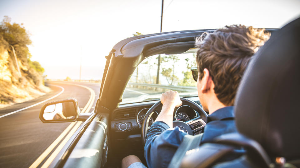 young man driving car