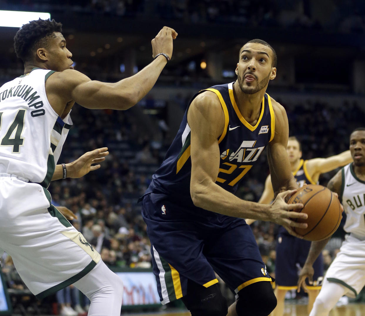 Rudy Gobert, right, reportedly suffered a sprained MCL in his left knee Friday. (AP)