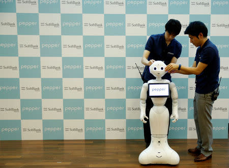 SoftBank's emotion-reading robot Pepper is seen before a photosession after a demonstration on the robot to show its compatibility with Google's Android software, at the company's headquarters in Tokyo, Japan, May 19, 2016. REUTERS/Toru Hanai