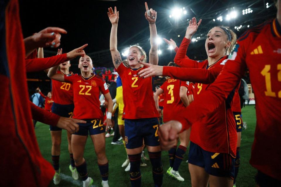 Members of Spain’s women’s soccer team, with fullback Ona Batlle at center, celebrate moments after winning the FIFA World Cup on Aug. 20. They became the first Spanish women’s team to bring home a World Cup title by beating England 1-0 in Sydney.<span class="copyright">Hannah Mckay—Reuters</span>