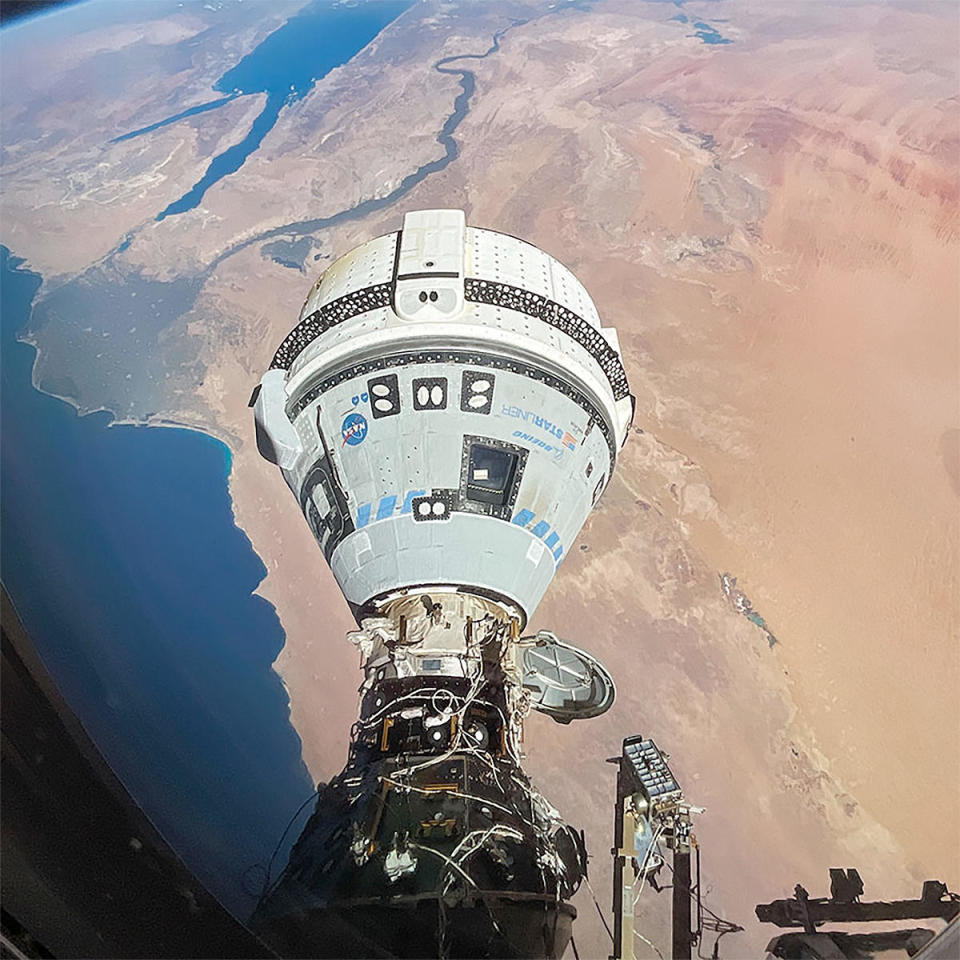 A camera aboard the International Space Station captured a spectacular view of Boeing's Starliner crew ferry ship as the two spacecraft sailed over North Africa, Egypt and the Middle East earlier in the ongoing test flight. The white drum-shaped service module, where the spacecraft's main propulsion system is housed, is attached to the base of the gray cone-shaped crew capsule. / Credit: NASA