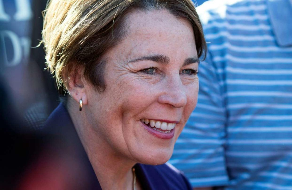 Democrat Gubernatorial nominee Maura Healey (C) speaks to the press at Maverick Square as she campaigns on the eve of the US midterm elections, in Boston, Massachusetts, on November 7, 2022. (Photo by Joseph Prezioso / AFP)