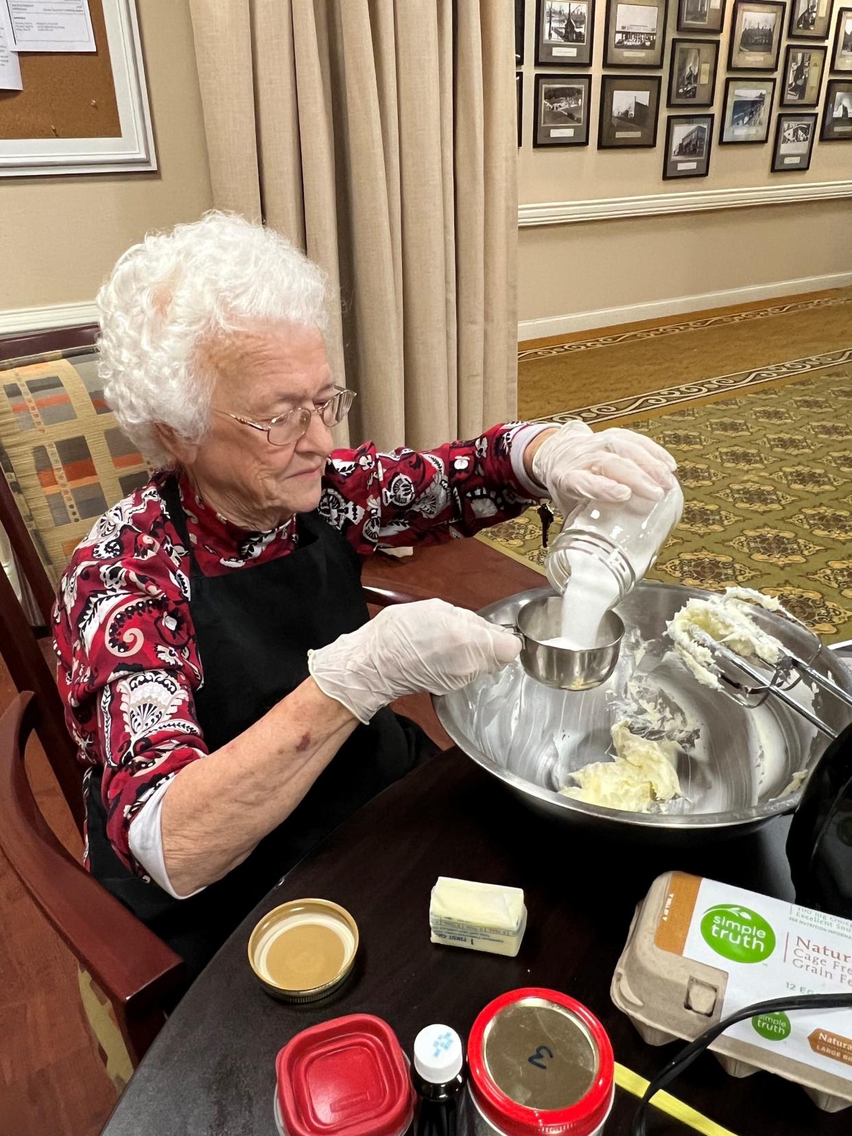 Morning Pointe resident Cleo Wayman puts together her special peanut butter pie.