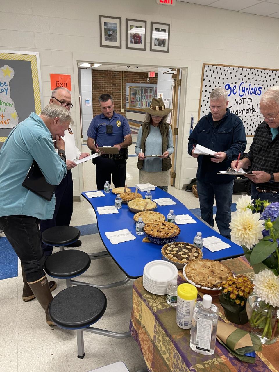 Apple Pie Contest judging.From left to right are Selectman Tom King, Fire Chief Mark Cotreau, Police Chief Kevin Walsh, Rye400 Committee Vice Chair, Debbie Toohey, Selectman Bob McGrath and Selectman Bill Epperson