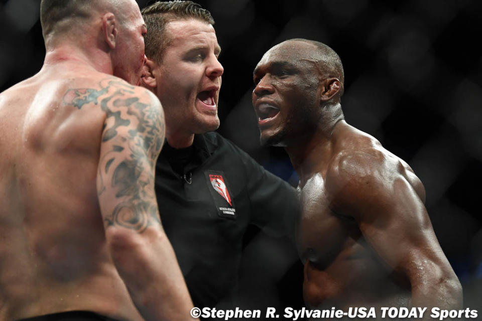 Dec 14, 2019; Las Vegas, NV, USA; Kamaru Usman (right) and Colby Covington (left) are separated by referee Marc Goddard during UFC 245 at T-Mobile Arena. Mandatory Credit: Stephen R. Sylvanie-USA TODAY Sports