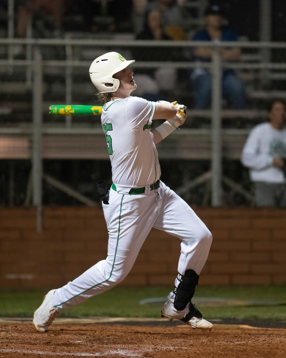 Jackson Hiatt (25) connects for a solo home run cutting the Aces lead to 3-1 during the Owensboro Catholic vs Pensacola Catholic baseball game at Pensacola Catholic High School on Wednesday, April 6, 2022.