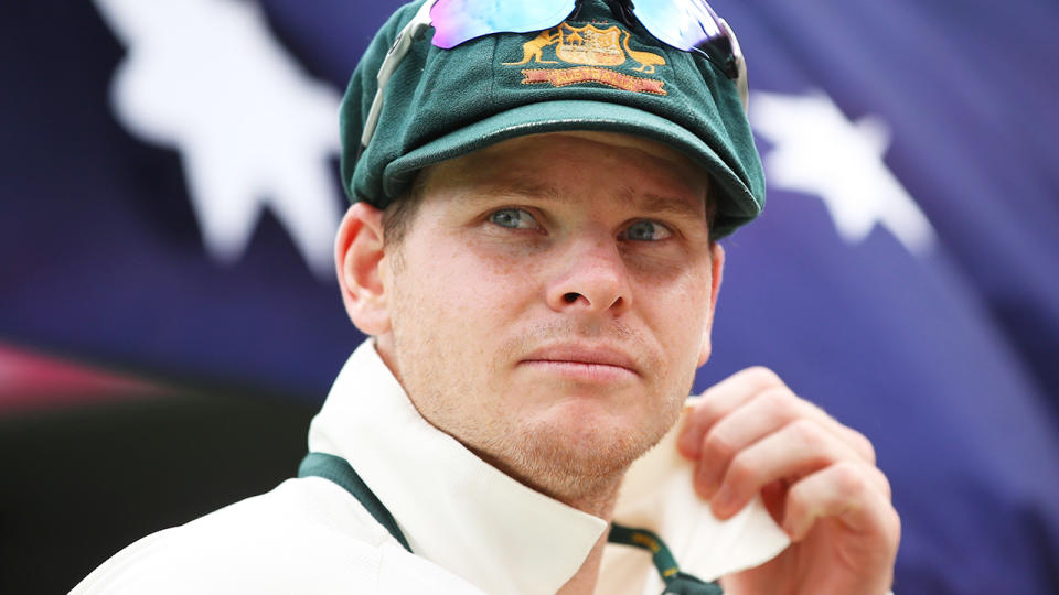 Steve Smith is pictured walking out for Australia at a Test match.