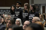 Protesters stand up during a Senate Judiciary Committee hearing with social medial platform heads on Capitol Hill in Washington, Wednesday, Jan. 31, 2024, to discuss child safety. (AP Photo/Susan Walsh)