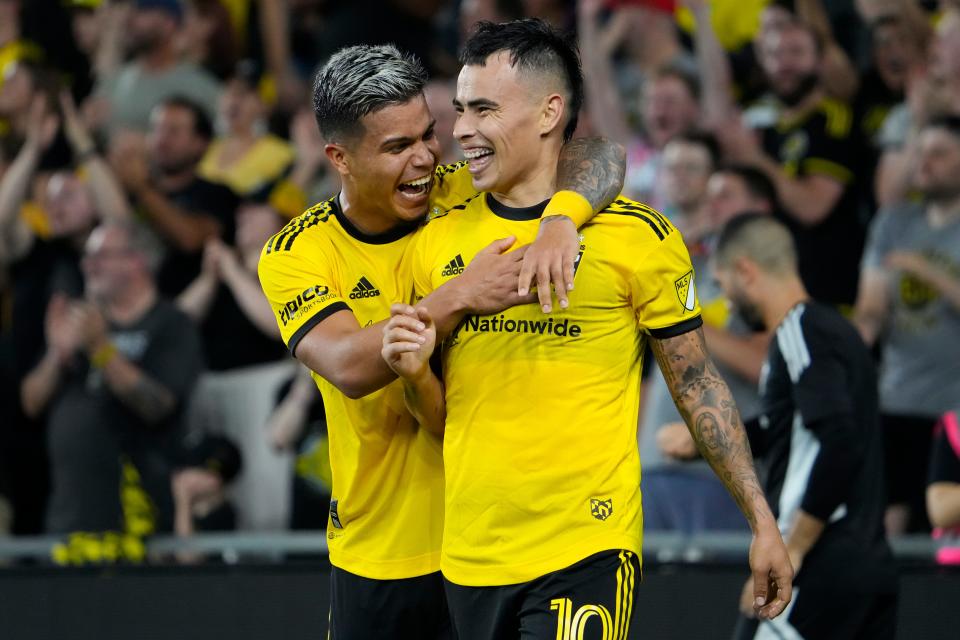 Aug 6, 2022; Columbus, Ohio, USA; Columbus Crew midfielder Lucas Zelarayan (10) reacts to scoring a goal with forward Cucho Hernandez (9) during the second half of the MLS game against New York City FC at Lower.com Field. The Crew won 3-2. Mandatory Credit: Adam Cairns-The Columbus Dispatch