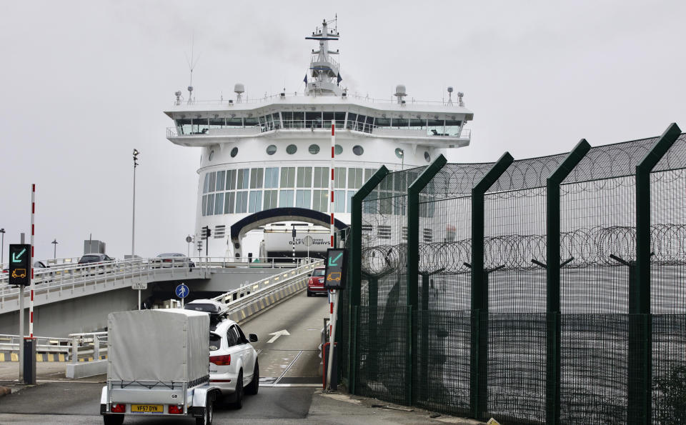 Cars are loaded onto a cross-channel ferry at the Port of Dunkerque, France, Friday Aug.14, 2020. British holiday makers in France were mulling whether to return home early Friday to avoid having to self-isolate for 14 days following the U.K. government's decision to reimpose quarantine restrictions on France amid a recent pick-up in coronavirus infections. (AP Photo/Olivier Matthys)