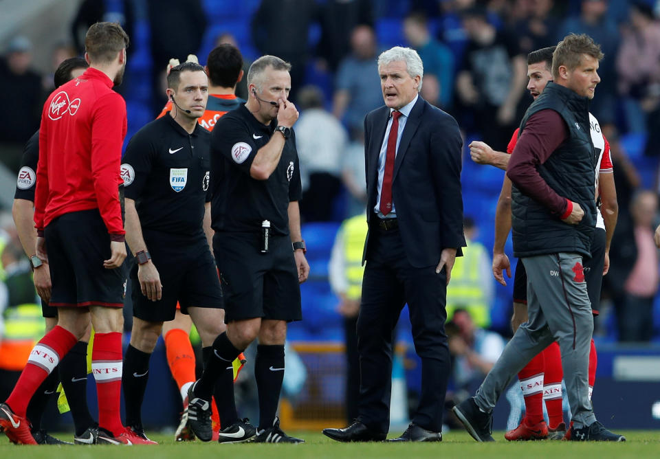 Not so Saintly: Southampton manager Mark Hughes talks to referee Jon Moss as his side drop two points