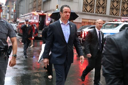 New York Governor Cuomo arrives at 787 7th Avenue in midtown Manhattan where helicopter crashed in New York