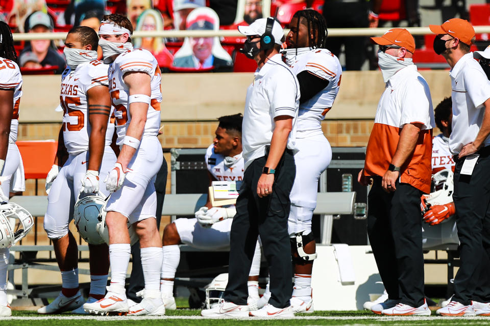 LUBBOCK, TEXAS - SEPTEMBER 26: Head coach Tom Herman of the Texas Longhorns, center, looks on during the first half of the college football game against the Texas Tech Red Raiders on September 26, 2020 at Jones AT&T Stadium in Lubbock, Texas. (Photo by John E. Moore III/Getty Images)