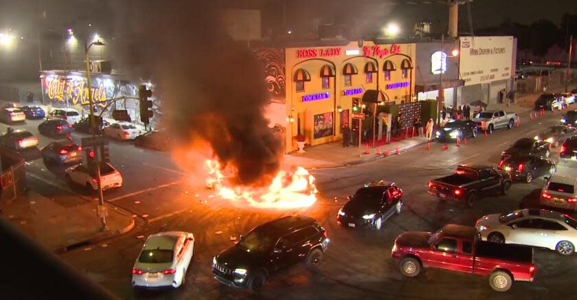 LOCATION: 18th & Main AREA/CITY: DTLA DETAILS: Two cars caught fire during a street takeover LAFD could not get to fire due to crowd of about 400 LAFD called for backup during the incident LAFD put water on the adjacent building to save it from catching fire LAPD in the area