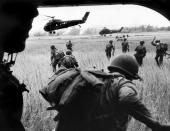 The view from inside Marine helicopter Yankee Papa 13, Vietnam, March 1965. (Larry Burrows—Time & Life Pictures/Getty Images) <br> <br> <a href="http://life.time.com/history/vietnam-war-one-ride-with-yankee-papa-13/#1" rel="nofollow noopener" target="_blank" data-ylk="slk:Click here to see the full collection at LIFE.com;elm:context_link;itc:0;sec:content-canvas" class="link ">Click here to see the full collection at LIFE.com</a>