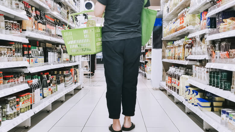 woman shopping for sauce