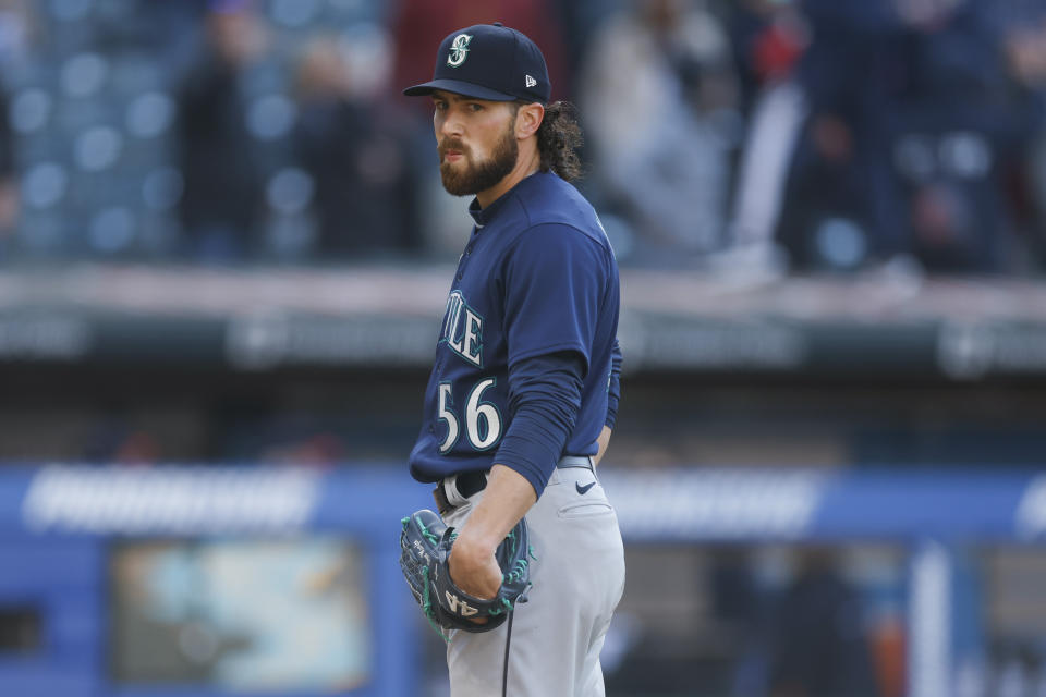 Seattle Mariners relief pitcher Penn Murfee reacts after giving up the game winning run to the Cleveland Guardians during the 12th inning of a baseball game, Sunday, April 9, 2023, in Cleveland. (AP Photo/Ron Schwane)