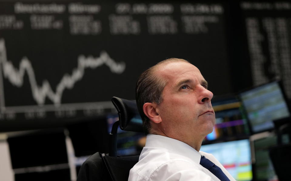 Stock traders monitor stock prices on a stock exchange during the ongoing spread of the novel coronavirus disease (COVID-19) in Frankfurt, Germany, October 27, 2020.  REUTERS/Kai Pfaffenbach