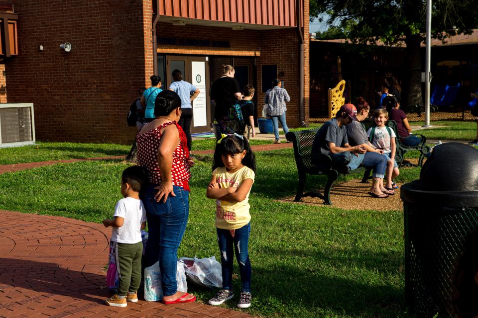 Parents and students wait to be let into Riverside Elementary School for their first day back in Columbia, Tenn. on Monday, Aug. 7, 2023.
