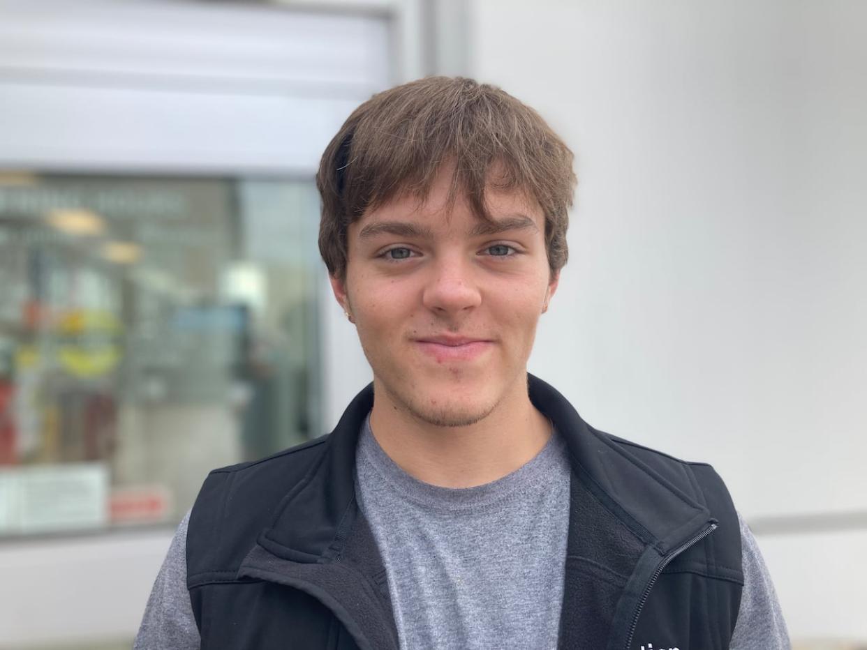 Recent high school graduate Ethan Morrison said he won't miss the smeared ink on his hands from taking notes with his left hand. (Mariam Mesbah/CBC - image credit)